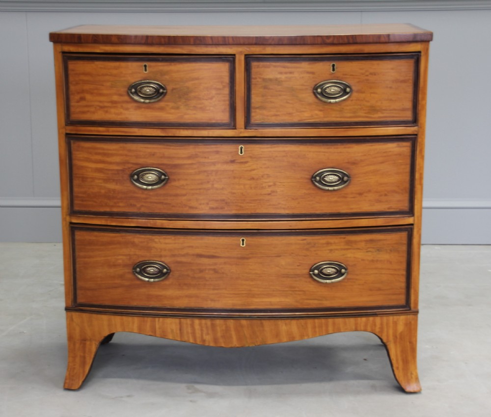 An 18th century satinwood chest of drawers.  View II