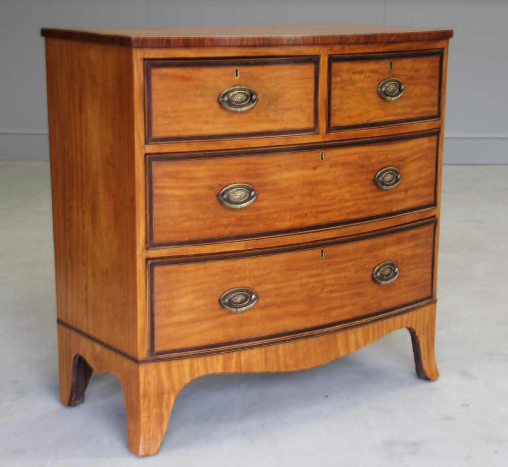 An 18th century satinwood chest of drawers.  View III