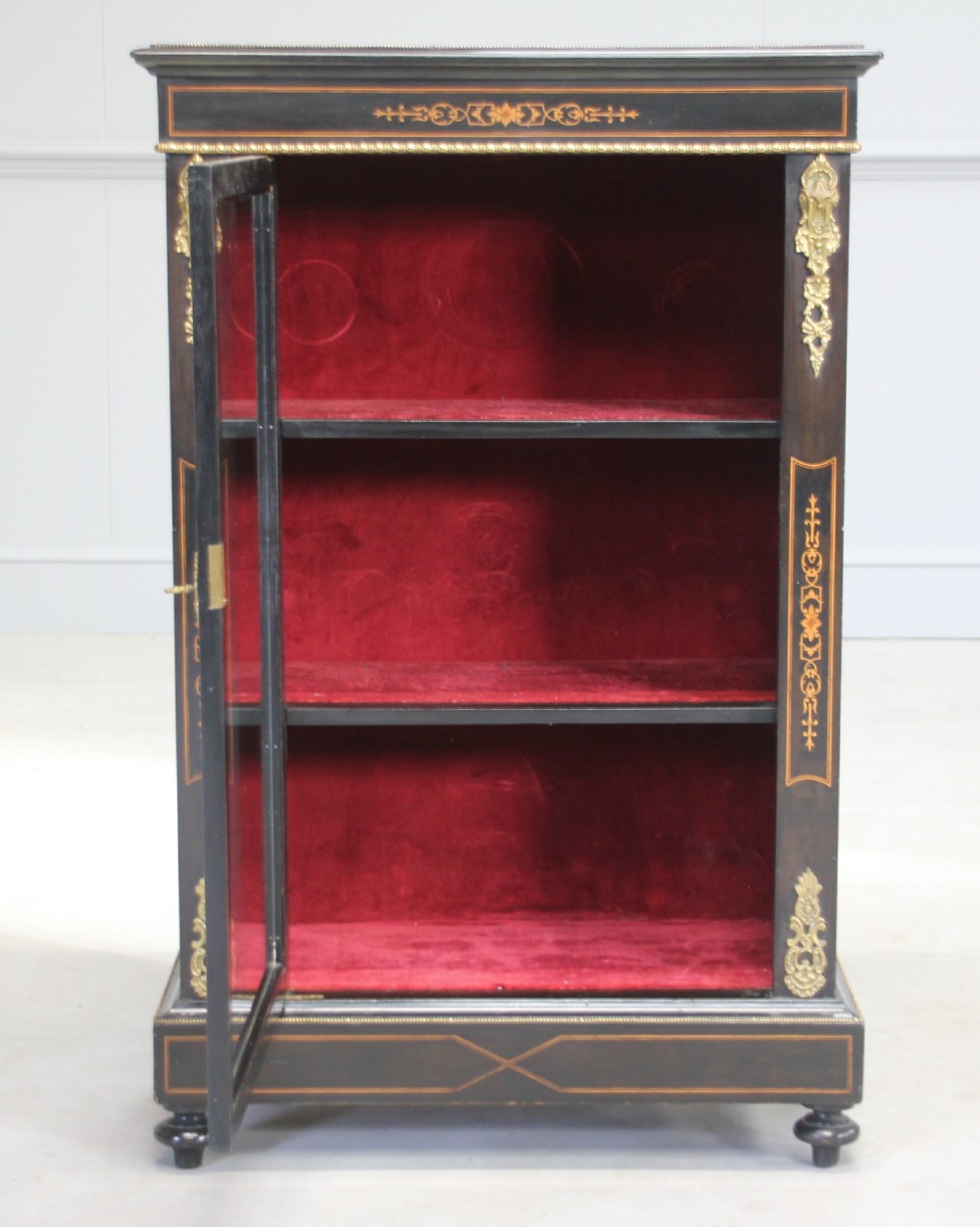 A Victorian ebonized display cabinet. View VIII