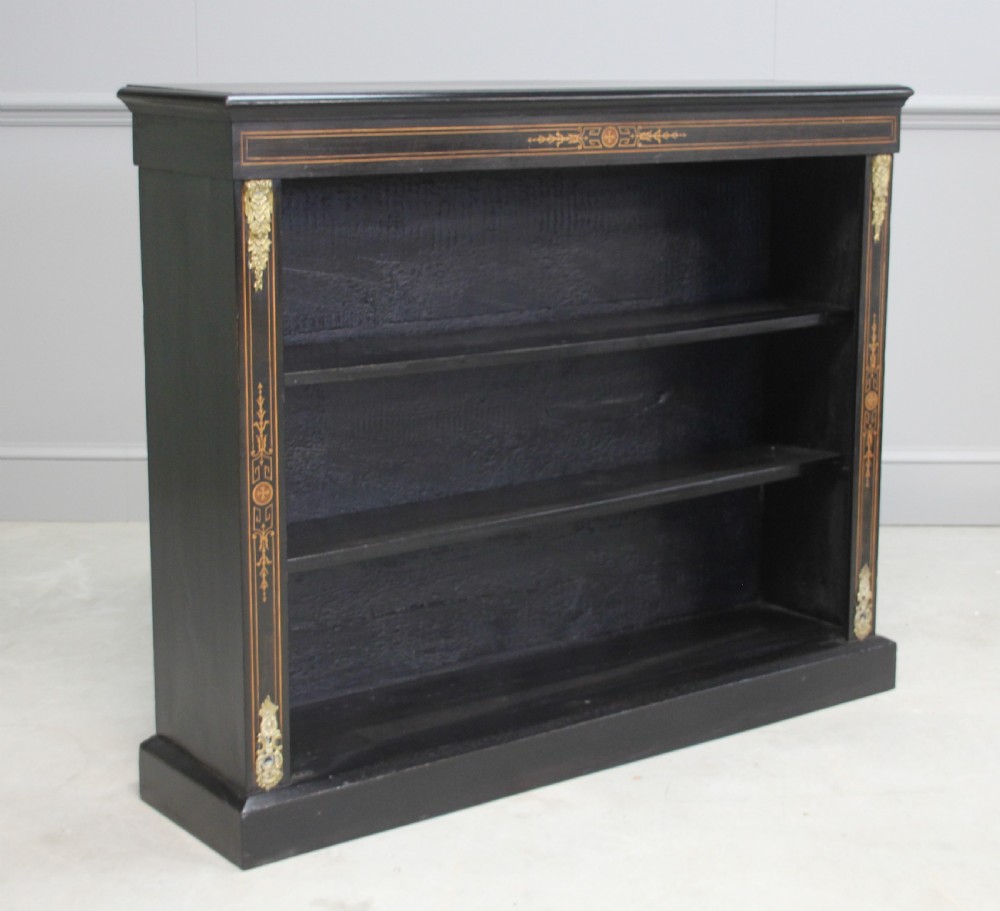 A Victorian ebonized open bookcase