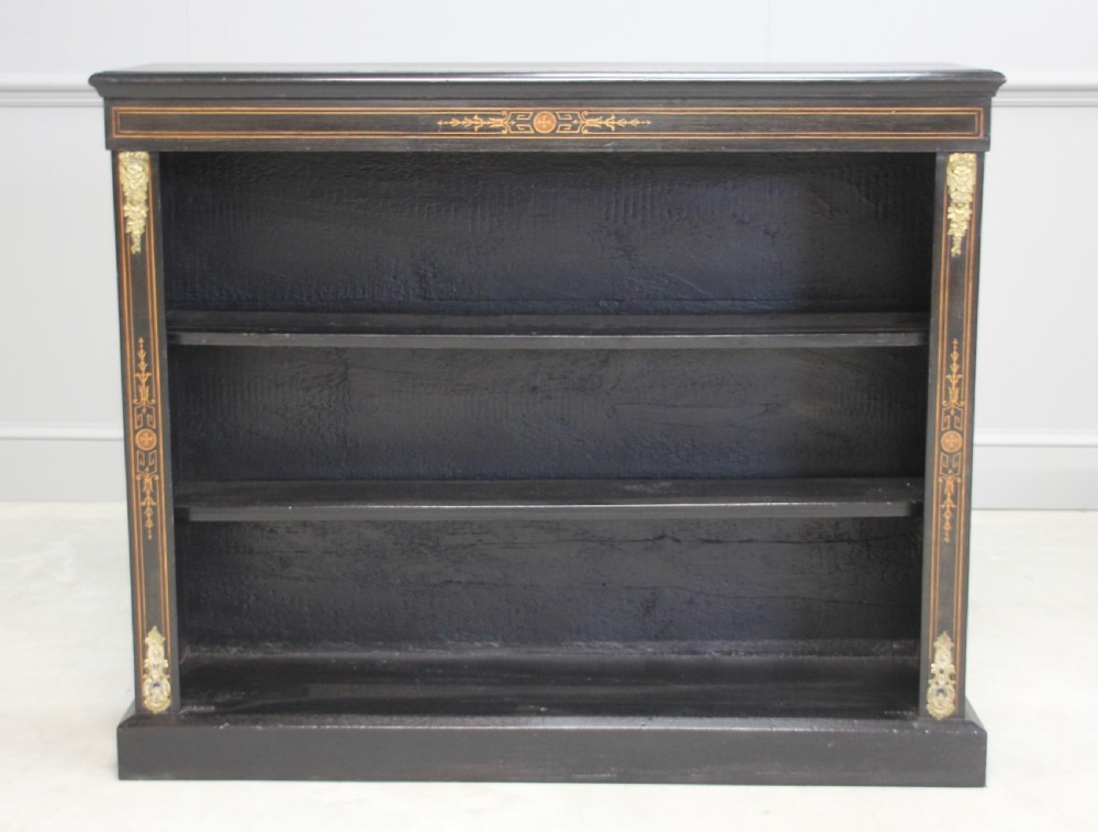 A Victorian ebonized open bookcase View II