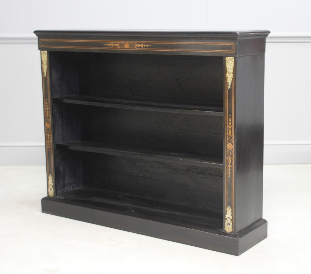 A Victorian ebonized open bookcase View III