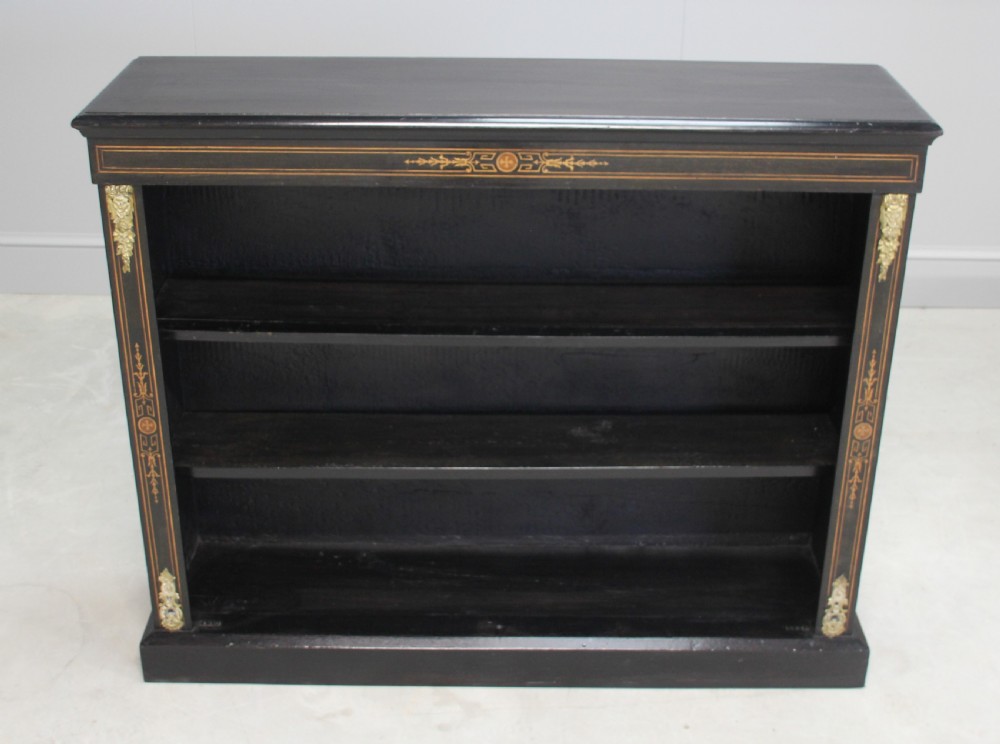 A Victorian ebonized open bookcase View VI