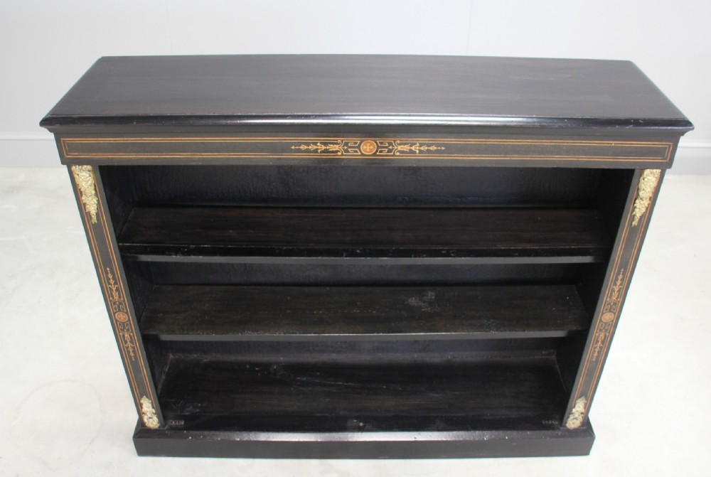 A Victorian ebonized open bookcase View VII