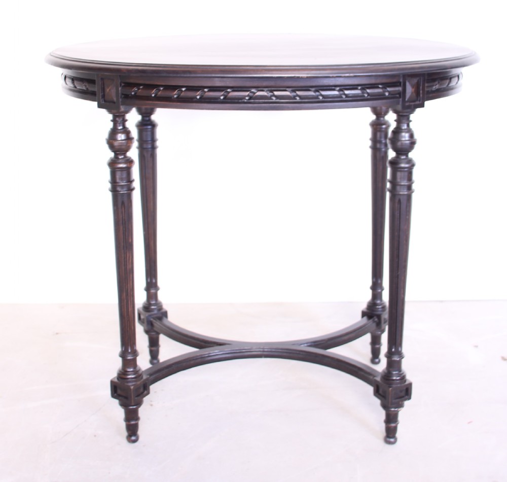 A 19th century ebonized table View III