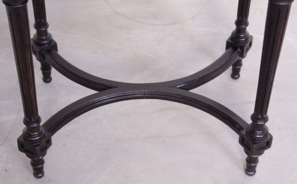 A 19th century ebonized table View VI