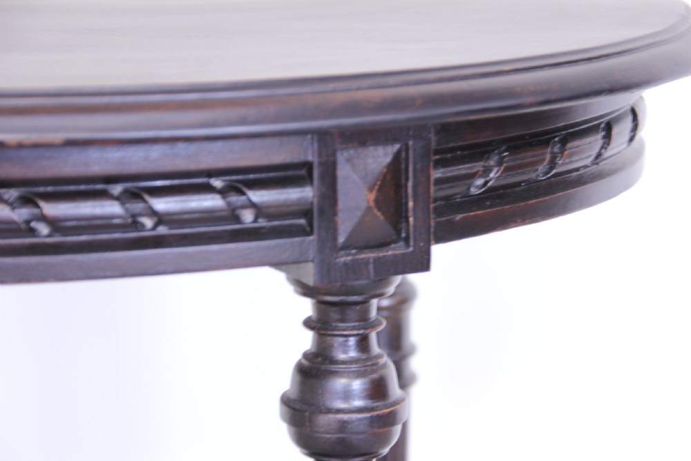 A 19th century ebonized table View VIII
