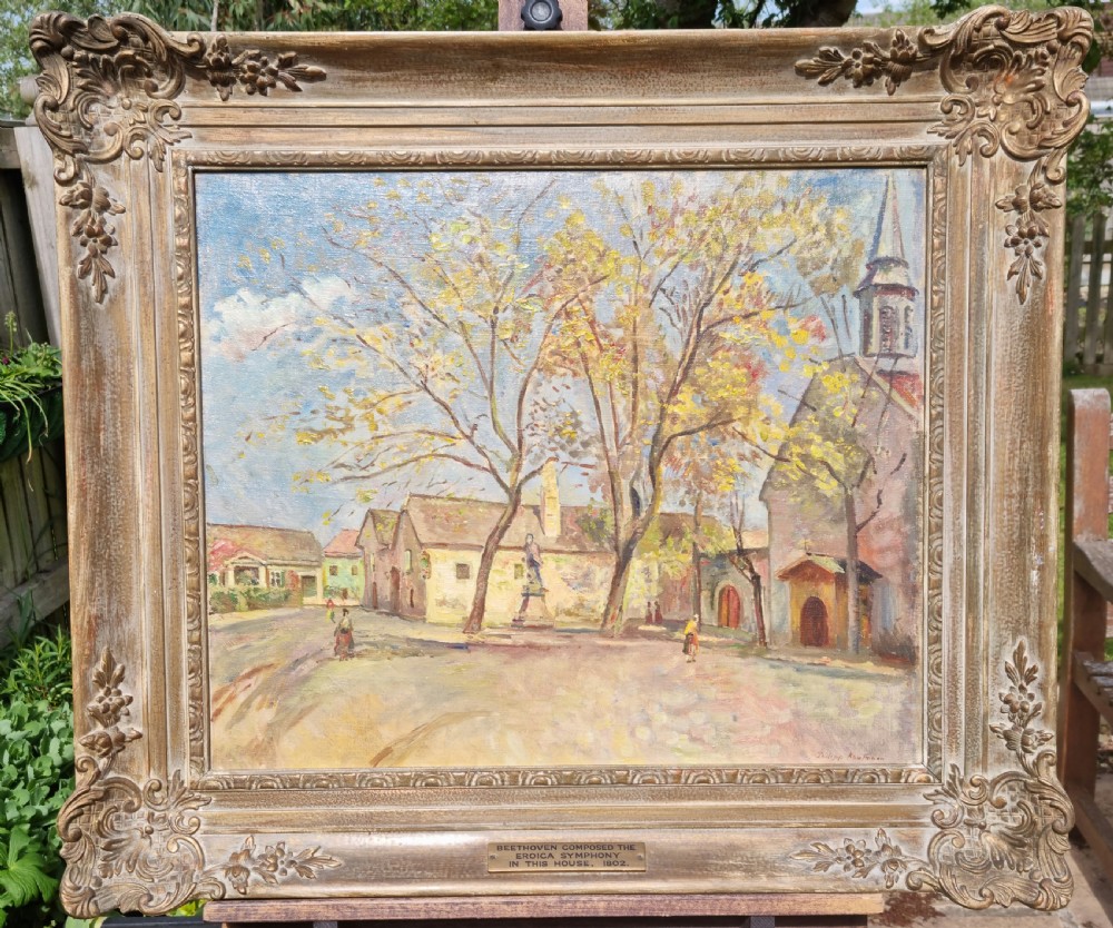 A carved framed oil on canvas.