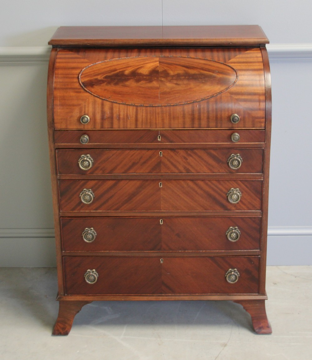 AN EDWARDIAN MAHOGANY CYLINDER BUREAU