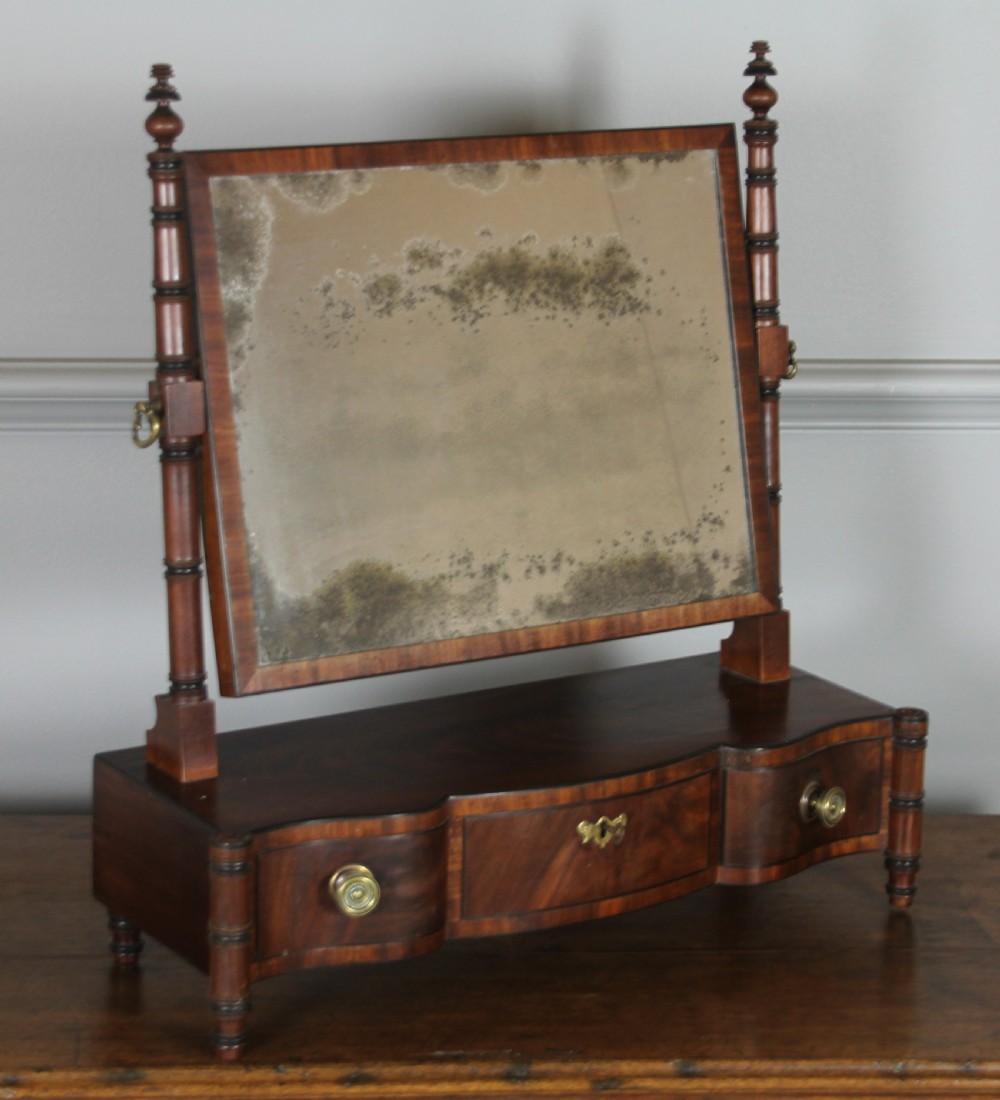A REGENCY MAHOGANY SWING MIRROR