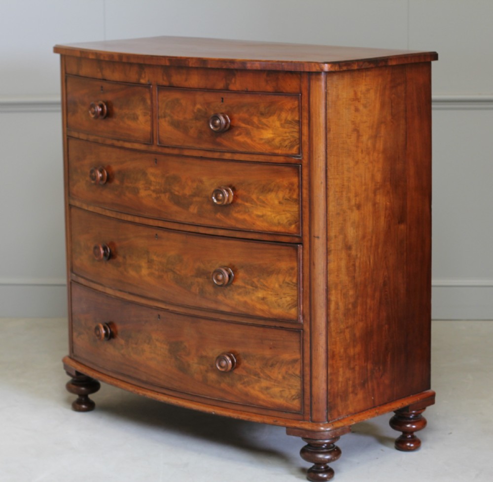A Victorian Curl Mahogany bow fronted chest of drawers