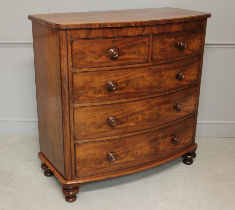 A Victorian Curl Mahogany bow fronted chest of drawers View II