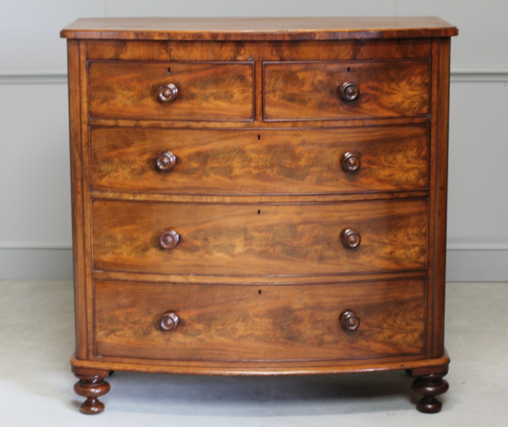 A Victorian Curl Mahogany bow fronted chest of drawers View VI