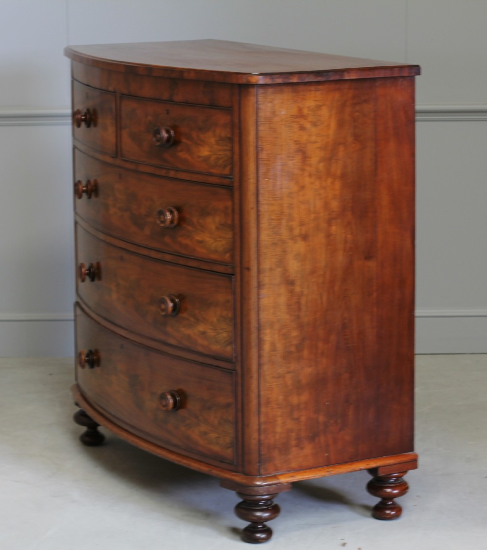 A Victorian Curl Mahogany bow fronted chest of drawers View VIII