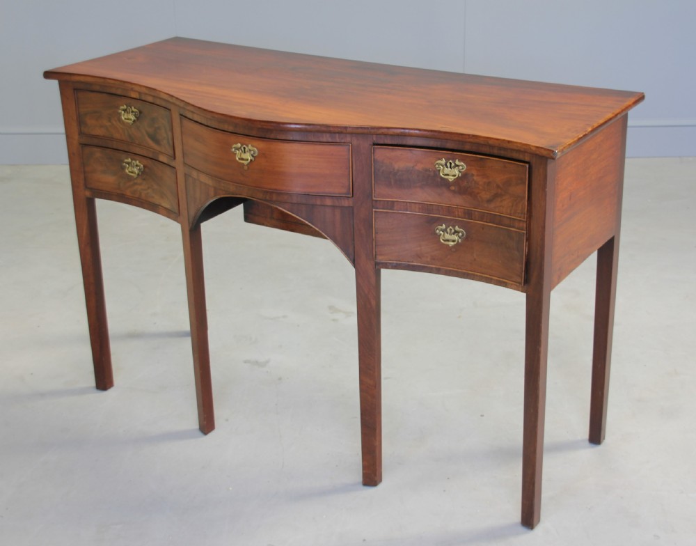 A REGENCY MAHOGANY SERPENTINE SIDEBOARD View IV