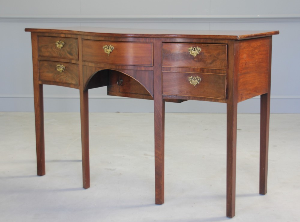 A REGENCY MAHOGANY SERPENTINE SIDEBOARD View V