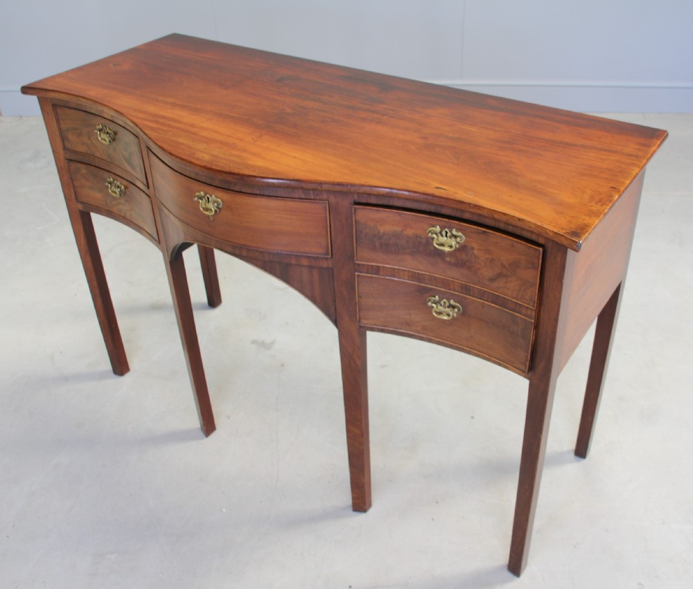 A REGENCY MAHOGANY SERPENTINE SIDEBOARD View VI