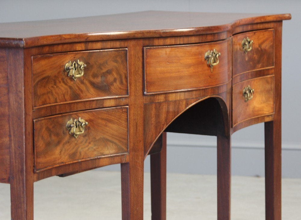 A REGENCY MAHOGANY SERPENTINE SIDEBOARD View VIII