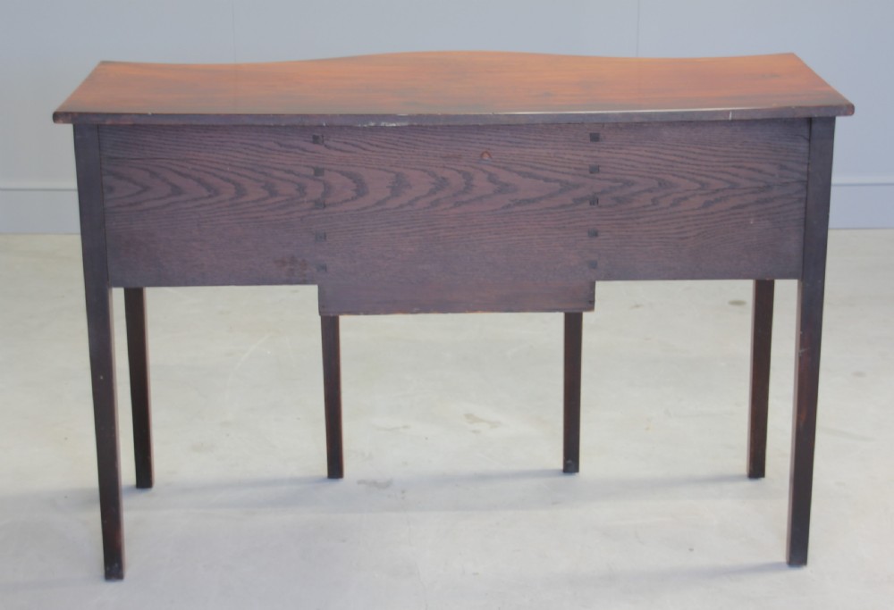 A REGENCY MAHOGANY SERPENTINE SIDEBOARD View IX