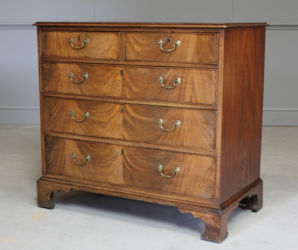 A GEORGE III MAHOGANY CHEST OF DRAWERS View II