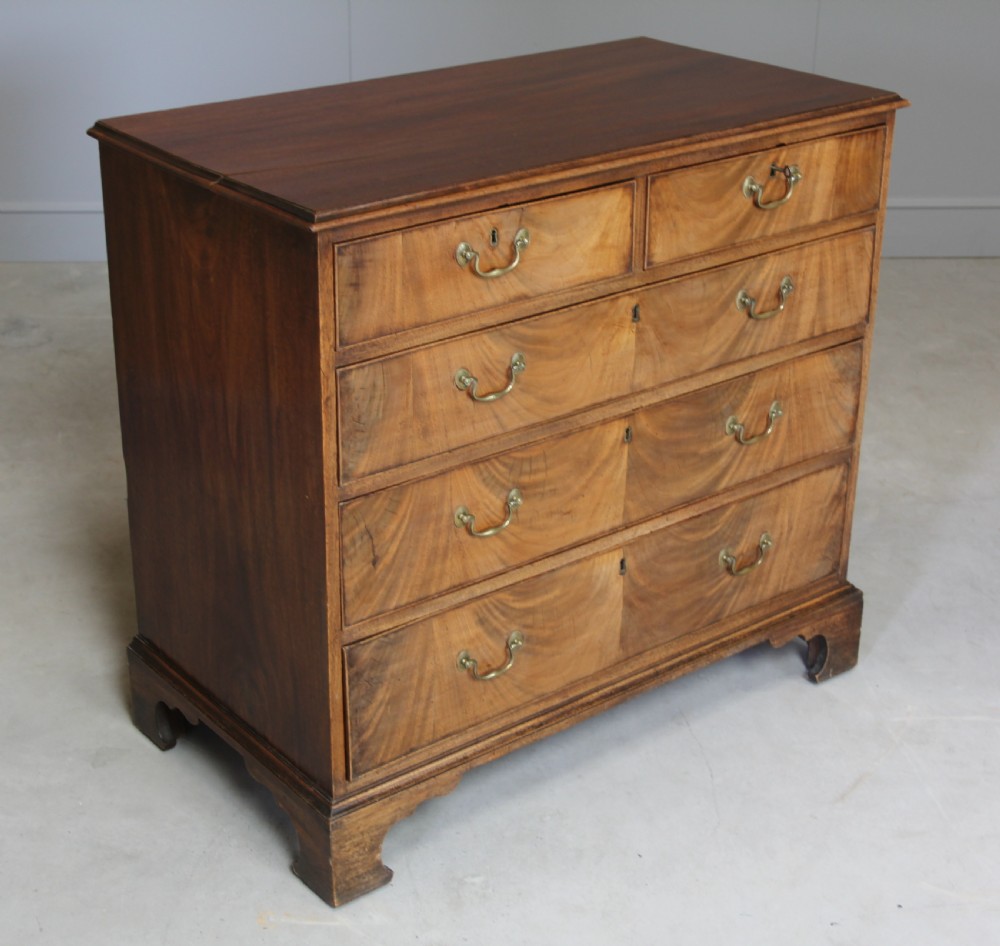 A GEORGE III MAHOGANY CHEST OF DRAWERS View IV