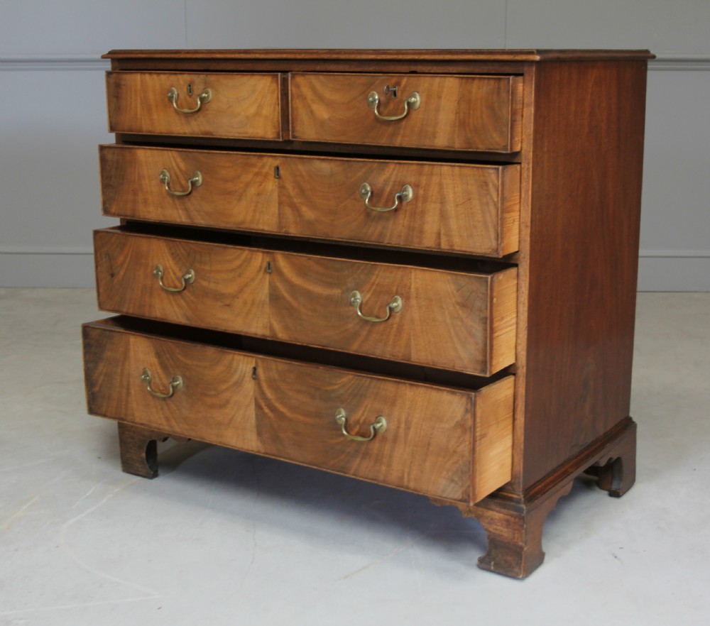 A GEORGE III MAHOGANY CHEST OF DRAWERS View VI