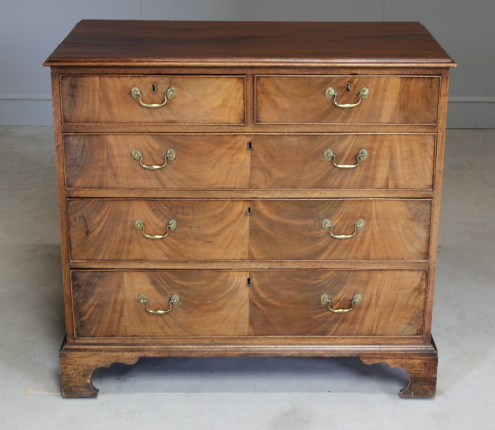 A GEORGE III MAHOGANY CHEST OF DRAWERS View VII