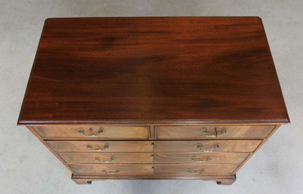 A GEORGE III MAHOGANY CHEST OF DRAWERS View IX