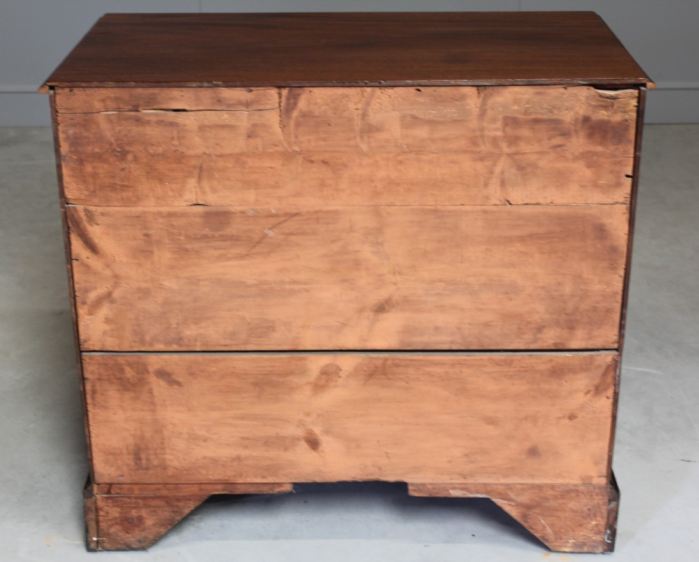 A GEORGE III MAHOGANY CHEST OF DRAWERS View X