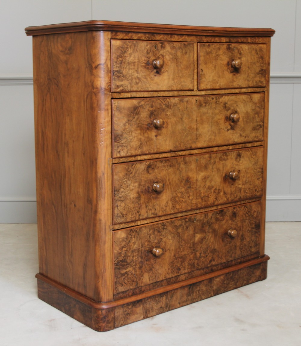 A Victorian burr walnut chest of drawers.