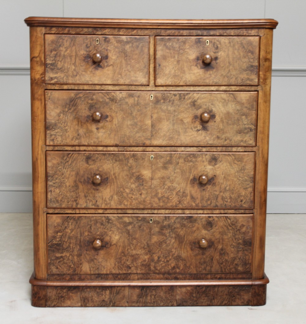 A Victorian burr walnut chest of drawers. View III