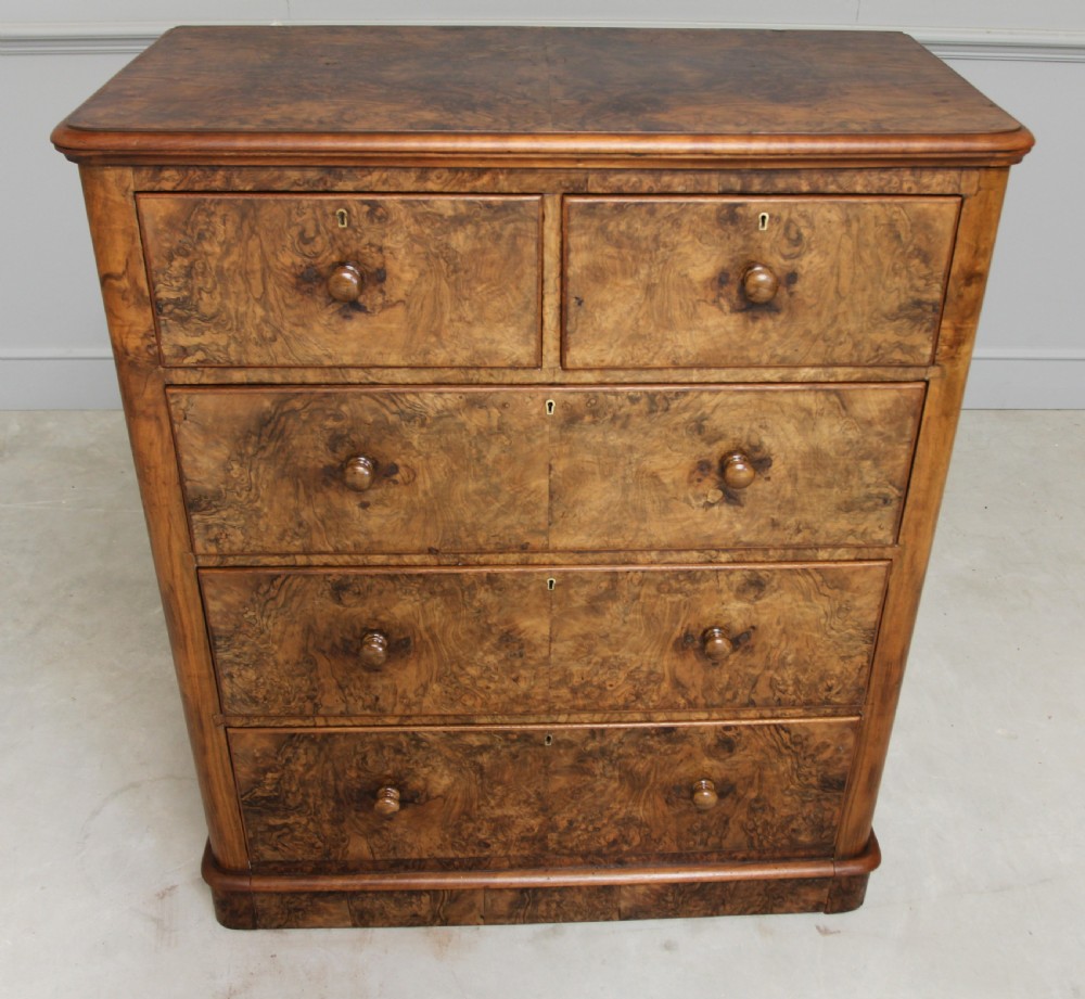 A Victorian burr walnut chest of drawers. View IV