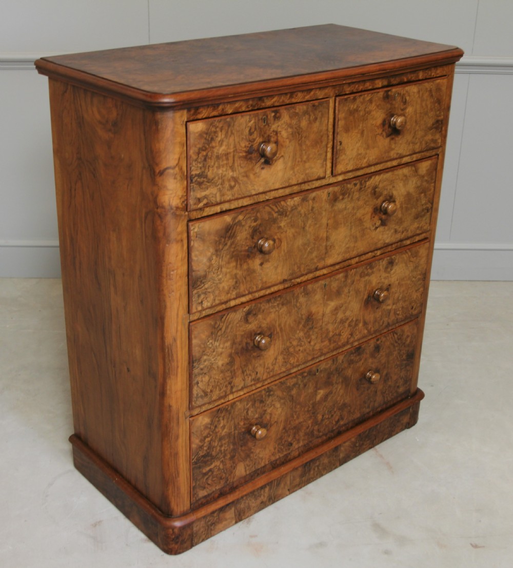 A Victorian burr walnut chest of drawers. View V