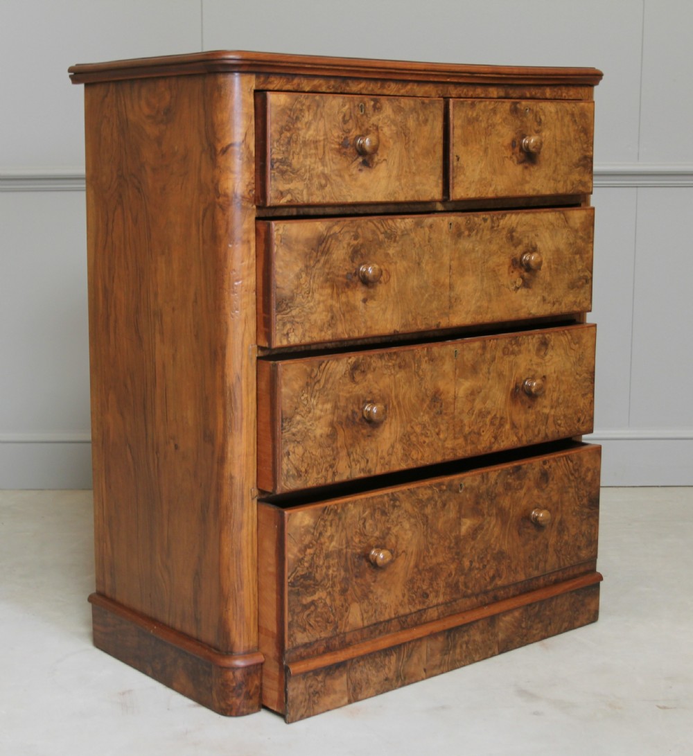 A Victorian burr walnut chest of drawers. View VII