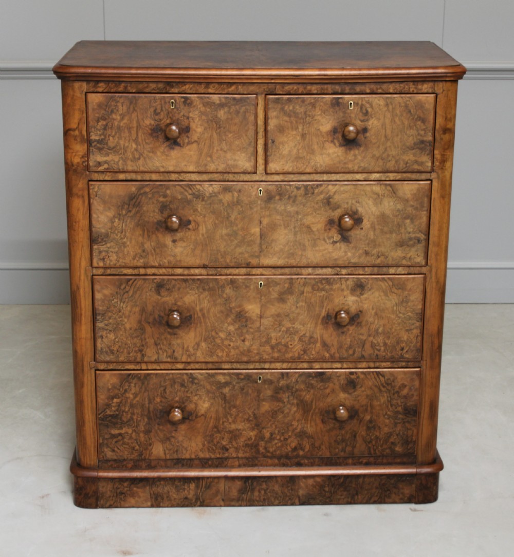 A Victorian burr walnut chest of drawers. View IX