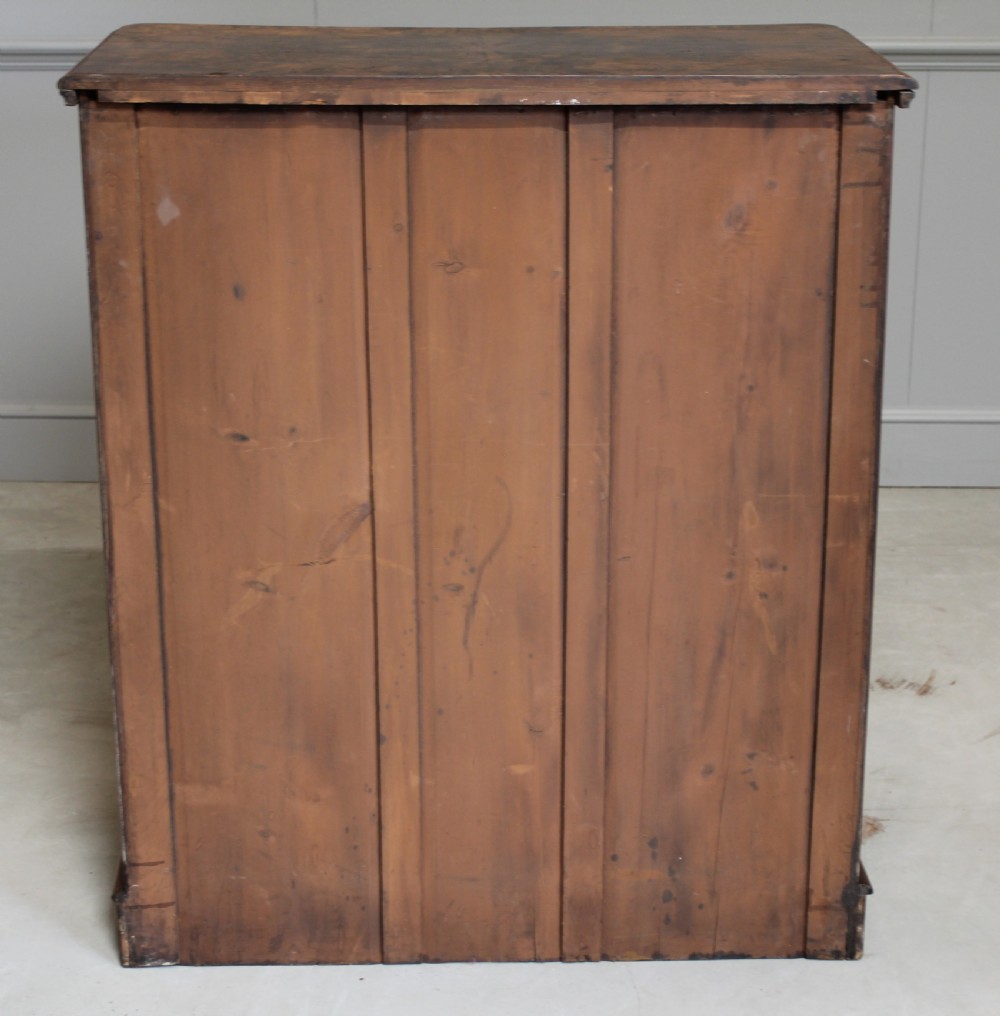 A Victorian burr walnut chest of drawers. View X
