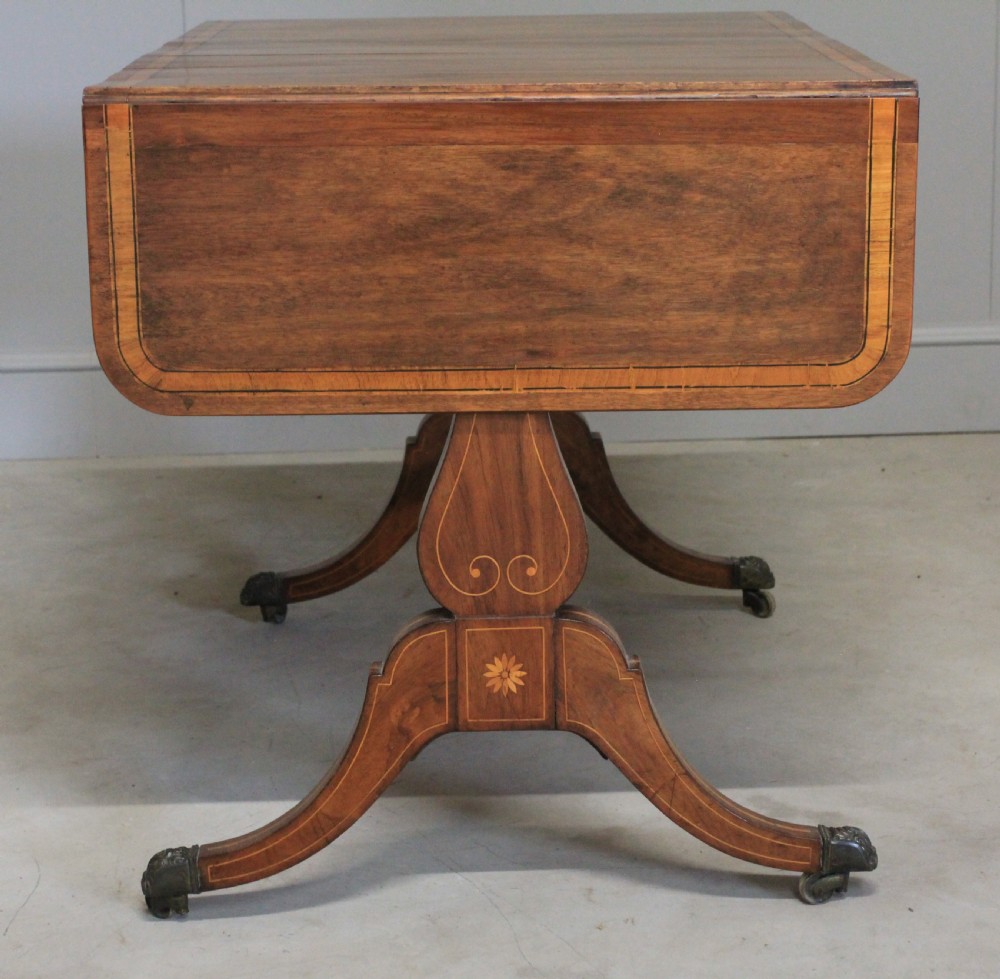 A Regency inlaid rosewood sofa table View VII