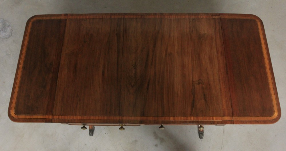 A Regency inlaid rosewood sofa table View X