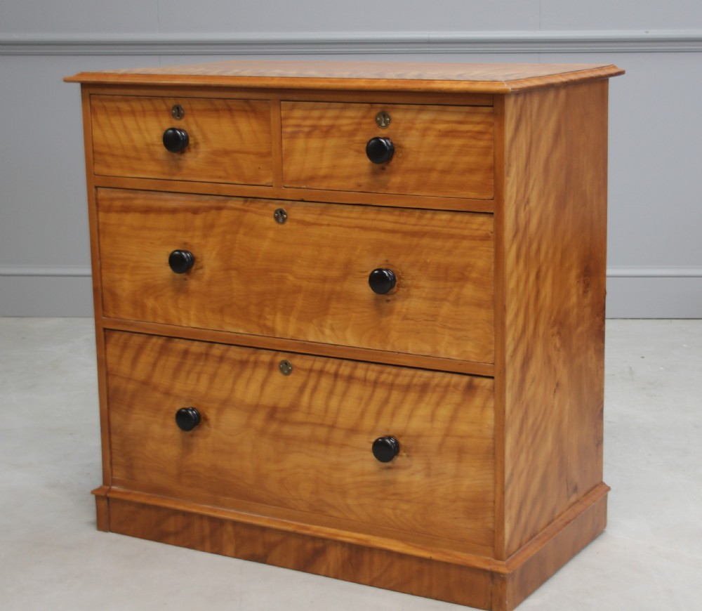 A VICTORIAN SATINBIRCH CHEST OF DRAWERS