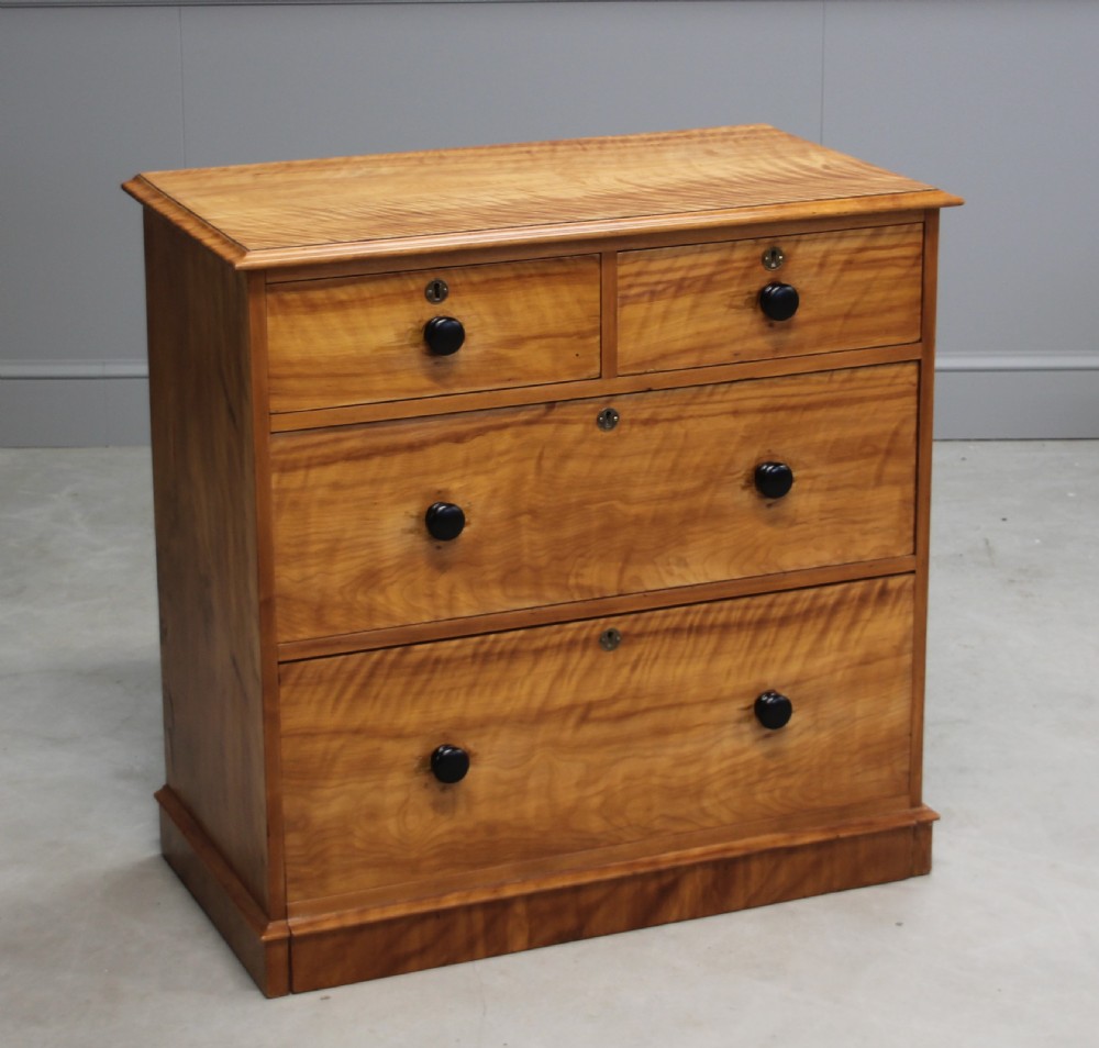 A VICTORIAN SATINBIRCH CHEST OF DRAWERS View II