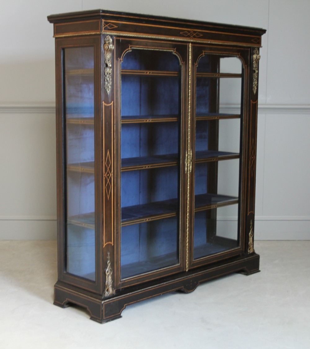 A VICTORIAN EBONIZED DISPLAY CABINET 