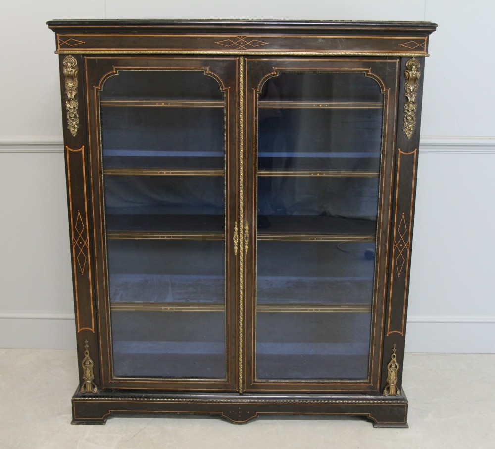 A VICTORIAN EBONIZED DISPLAY CABINET  View II