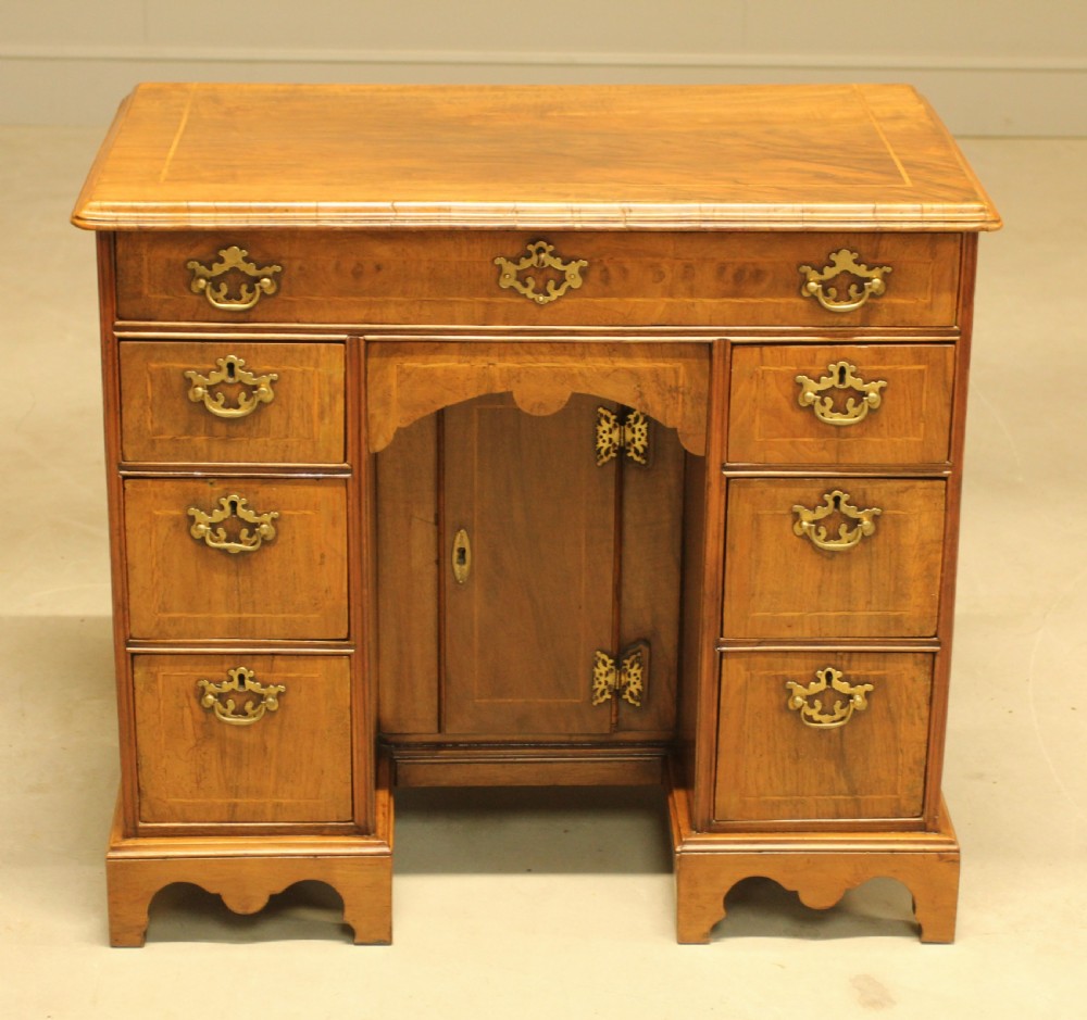 An early 18th century walnut kneehole desk.