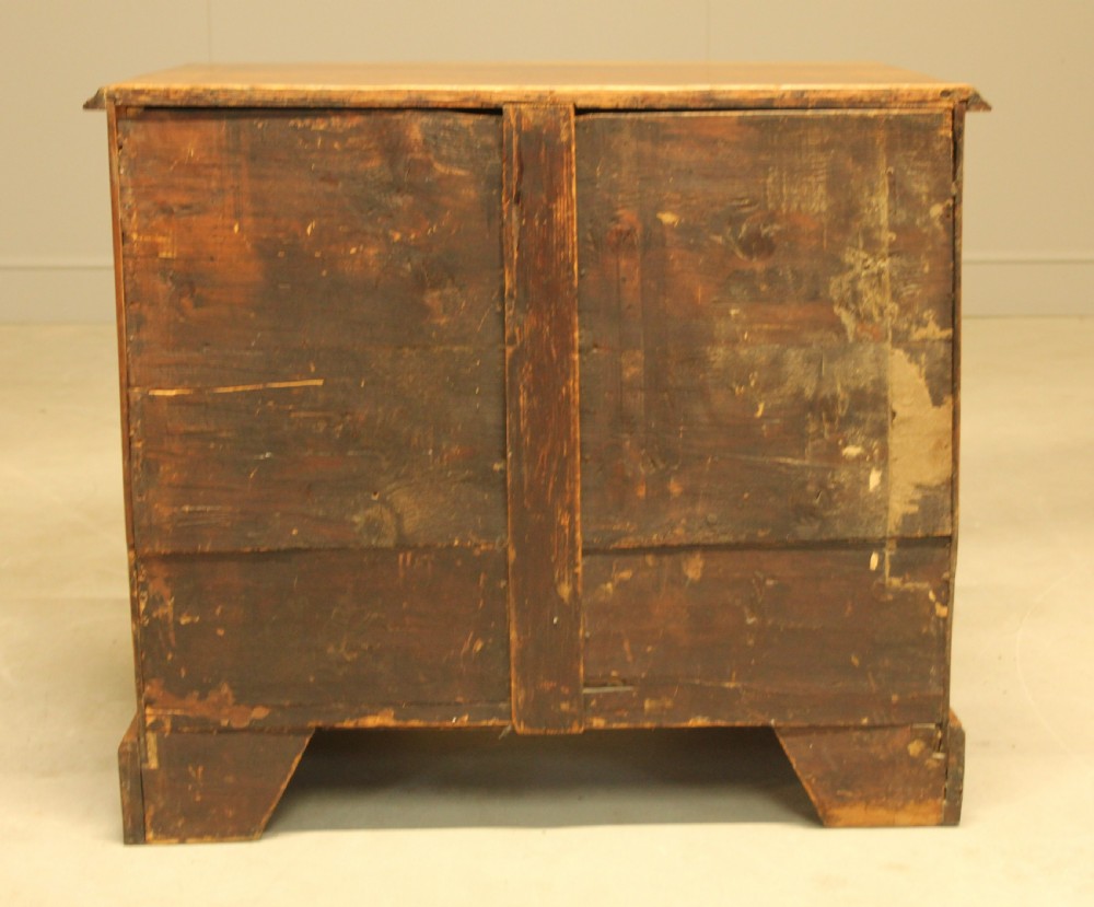 An early 18th century walnut kneehole desk. View IX