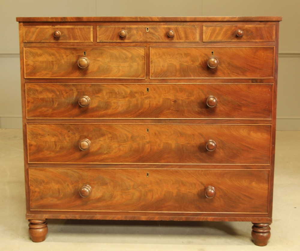 A 19th century flame mahogany chest of drawers.