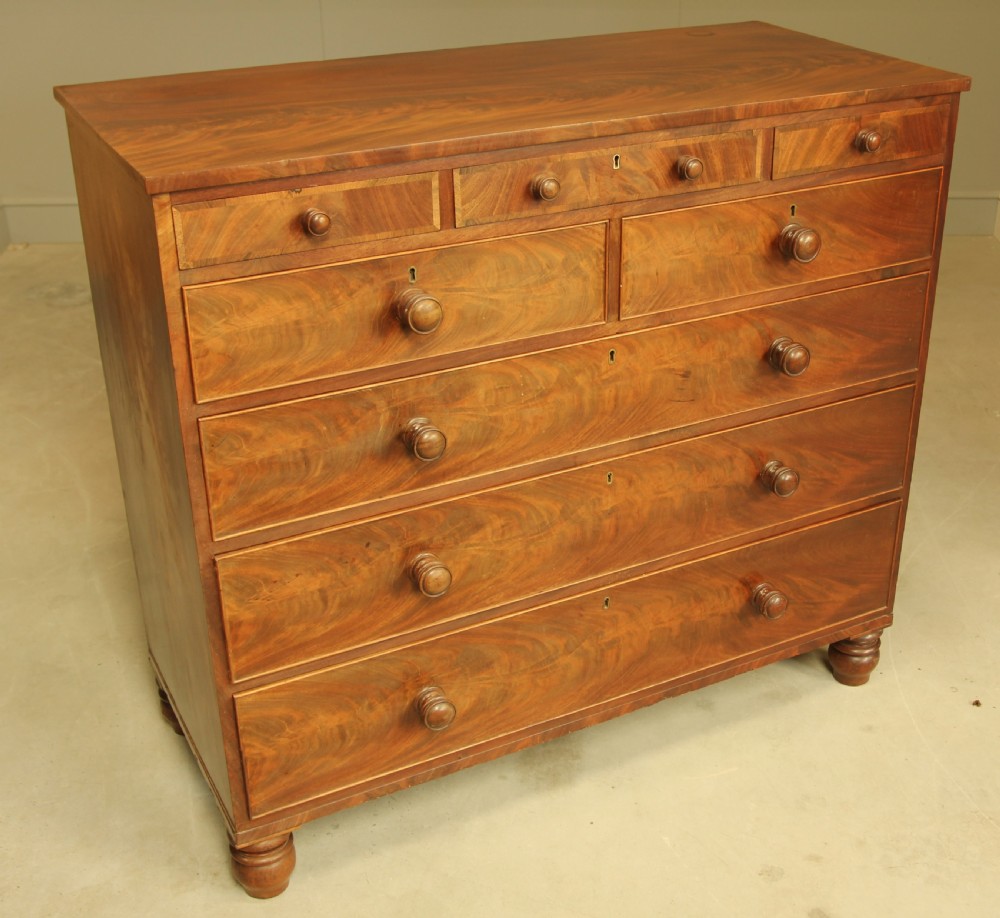 A 19th century flame mahogany chest of drawers. View V
