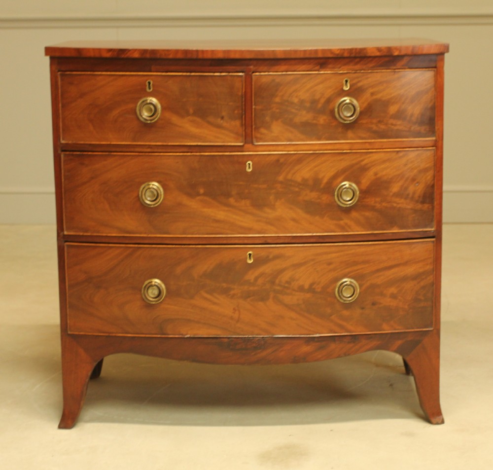 A Regency bow front chest of drawers. View II