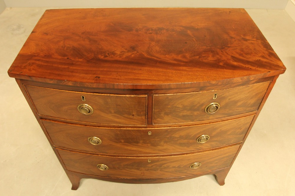 A Regency bow front chest of drawers. View IV