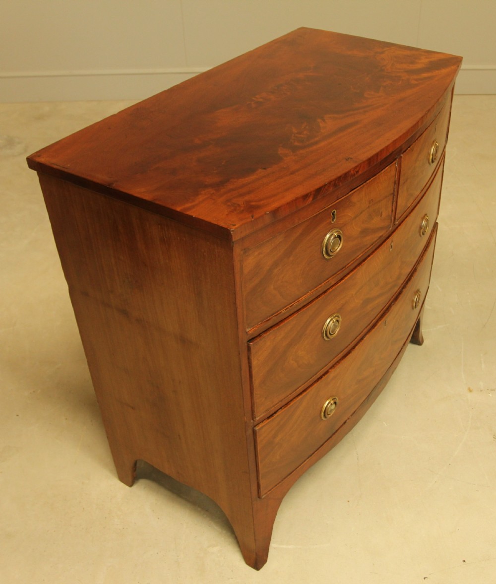 A Regency bow front chest of drawers. View V