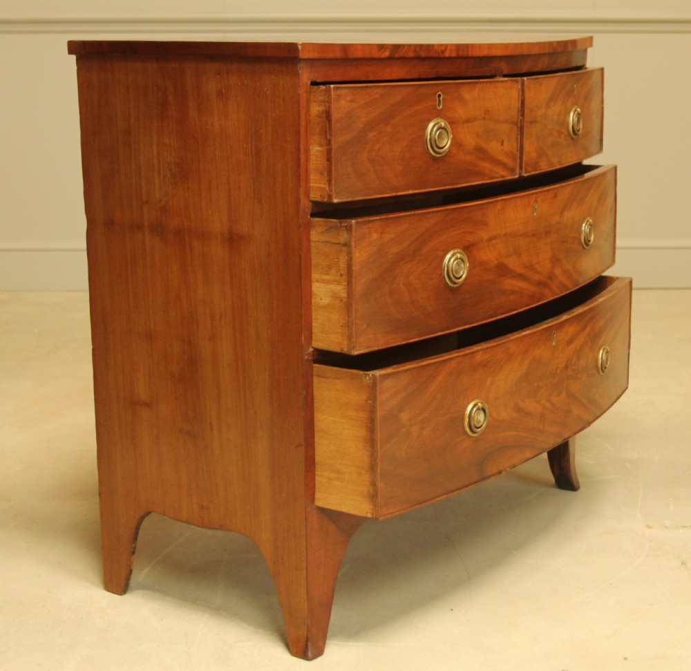 A Regency bow front chest of drawers. View VI